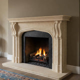 Handcrafted beige marble fireplace surround with a custom arched mantel design and elegant detailing
