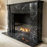 Elegant black marble fireplace with subtle veining and classic rectangular stone surround