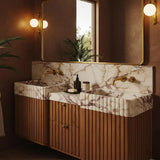 Custom walnut double vanity with fluted Calacatta Amber Viola marble sinks and backsplash