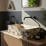 Hand-carved Calacatta Amber Viola marble vessel sink with fluted exterior on slatted wood vanity