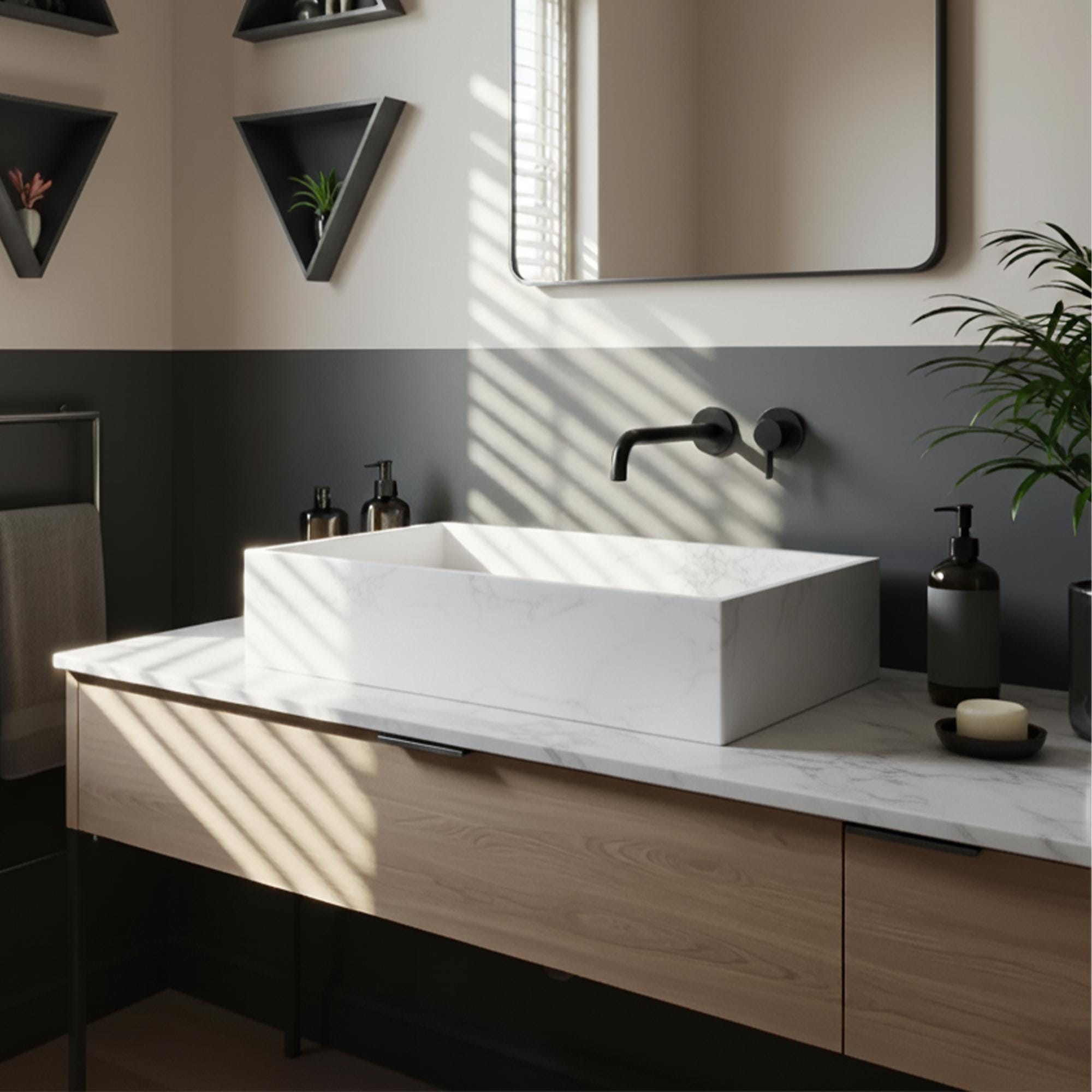 Modern bathroom featuring a rectangular Carrara marble vessel sink atop a sleek custom wood vanity with black matte wall-mounted faucet