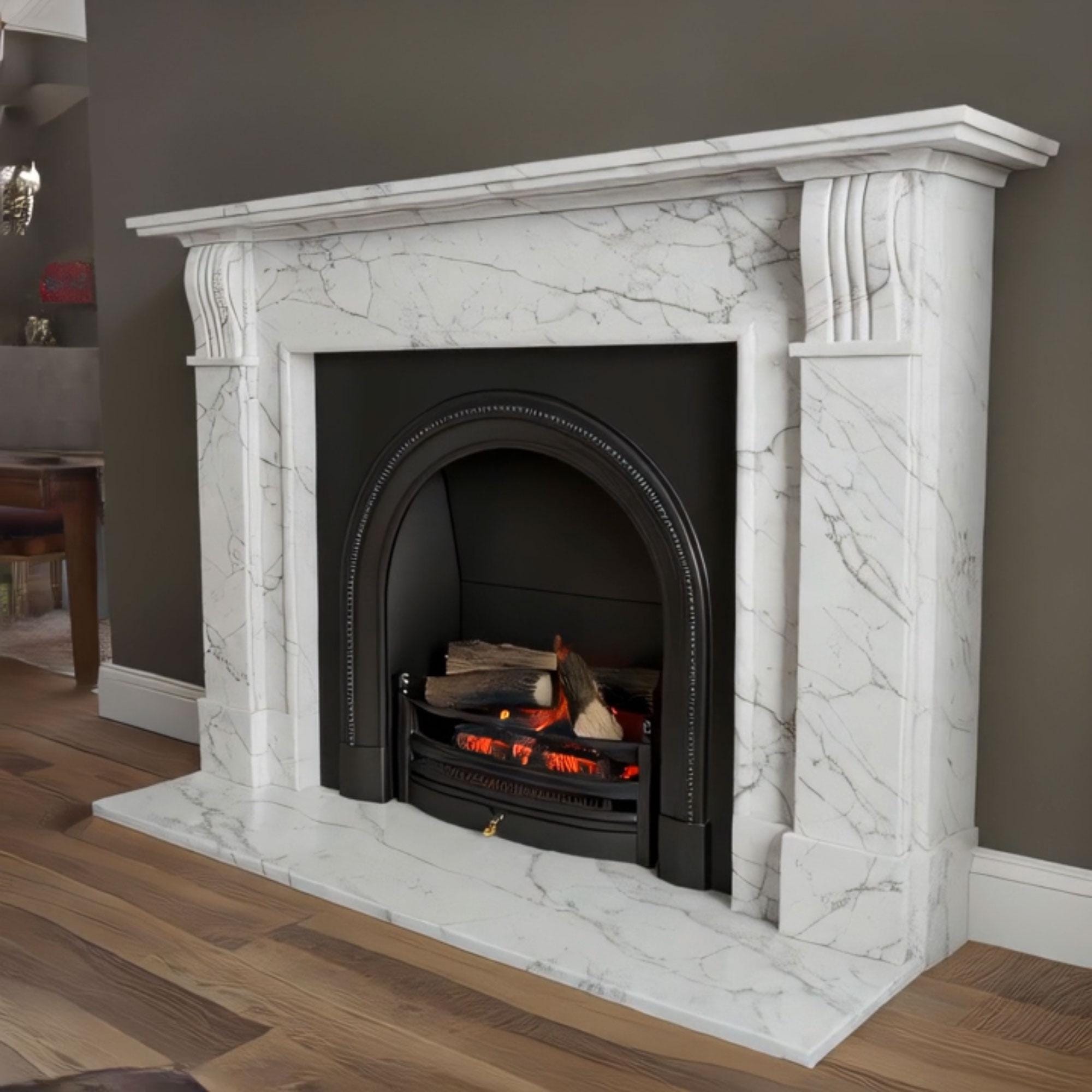Classic fireplace surround in Calacatta Viola marble, featuring detailed carvings and a curved arch design