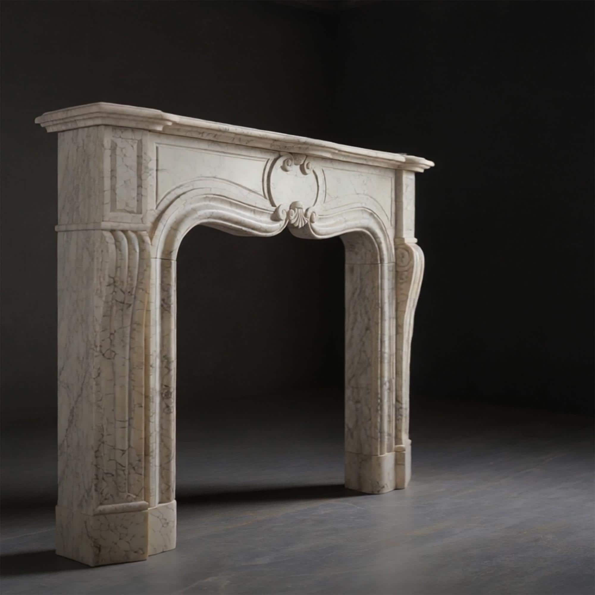 Luxurious cream marble fireplace surround with artistic shell centerpiece and sculpted vertical fluting