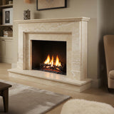 Handcrafted fireplace mantel made from cream travertine with clean lines and a timeless classic profile