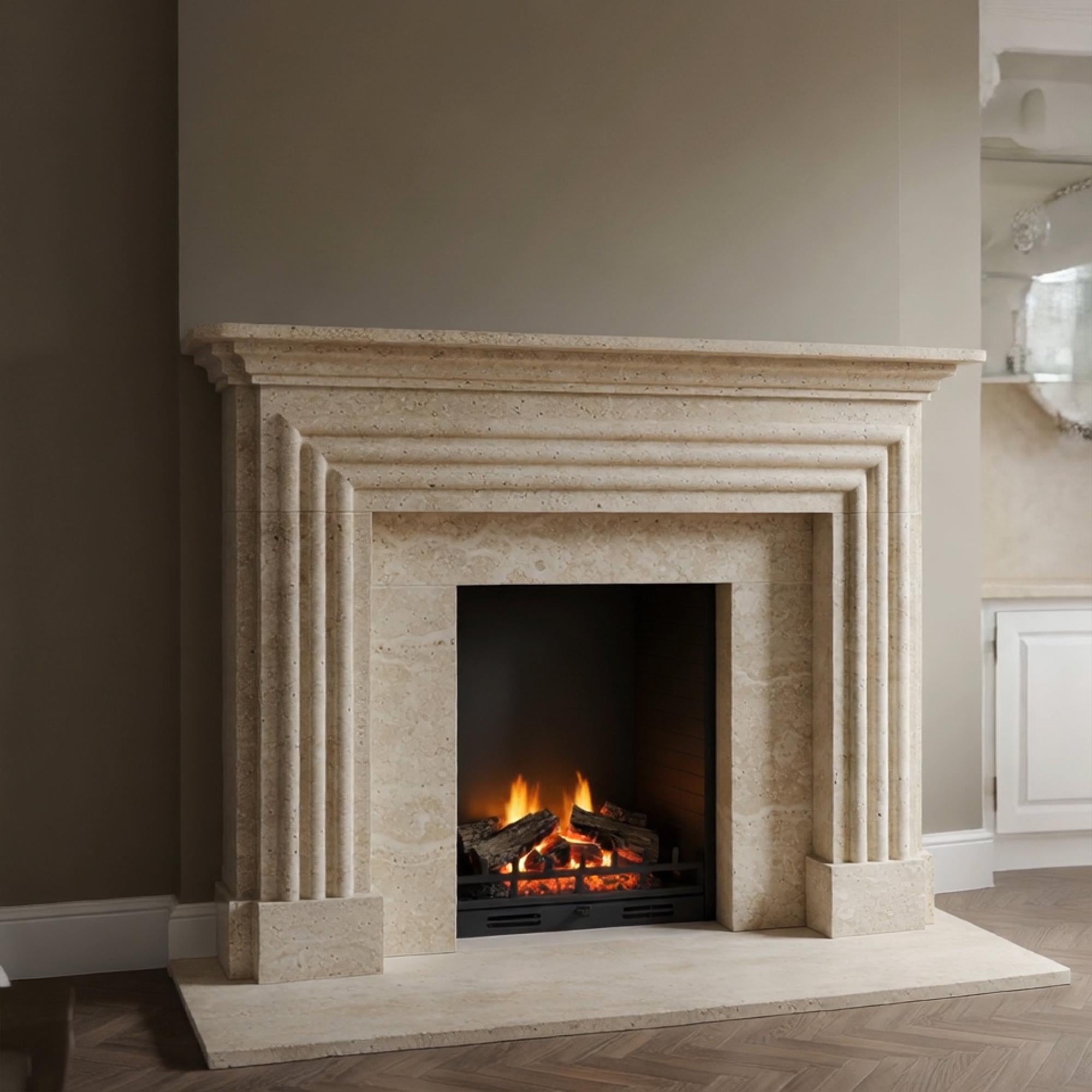 Custom handcrafted fireplace mantel made from light marble with layered architectural fluting