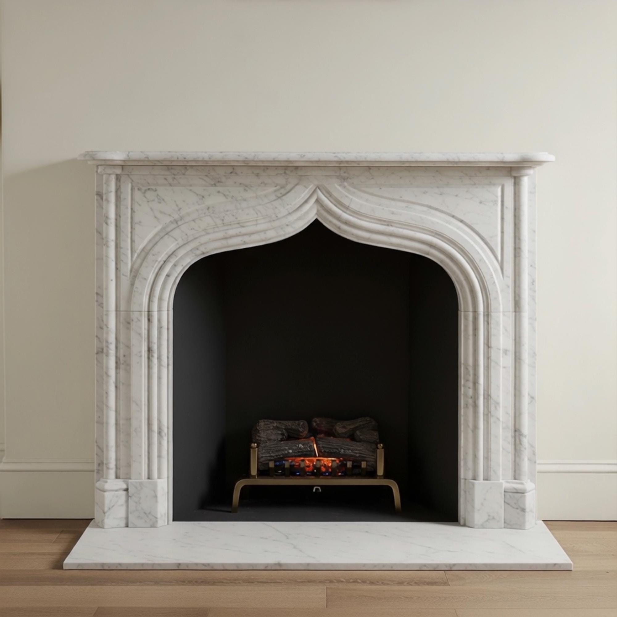 French Gothic-inspired fireplace mantel crafted in white marble with a dramatic arched design