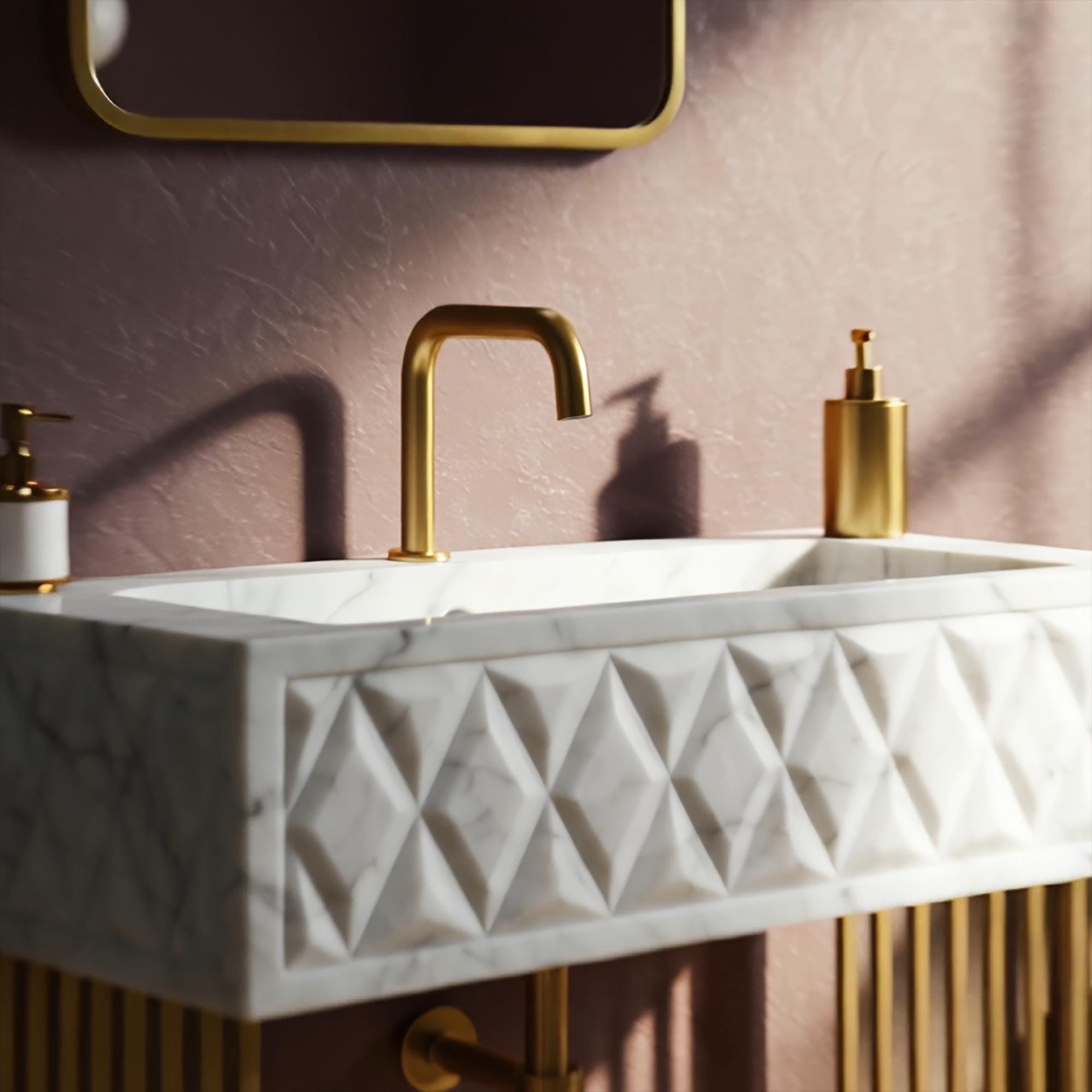 Bold geometric bathroom sink in faceted Carrara marble with symmetrical gold base legs