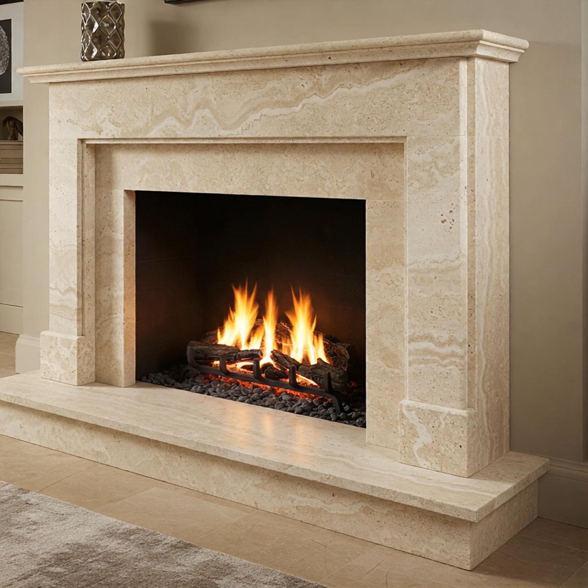 Artisan-carved fireplace mantel in cream travertine with a neutral, calming presence for luxury interiors