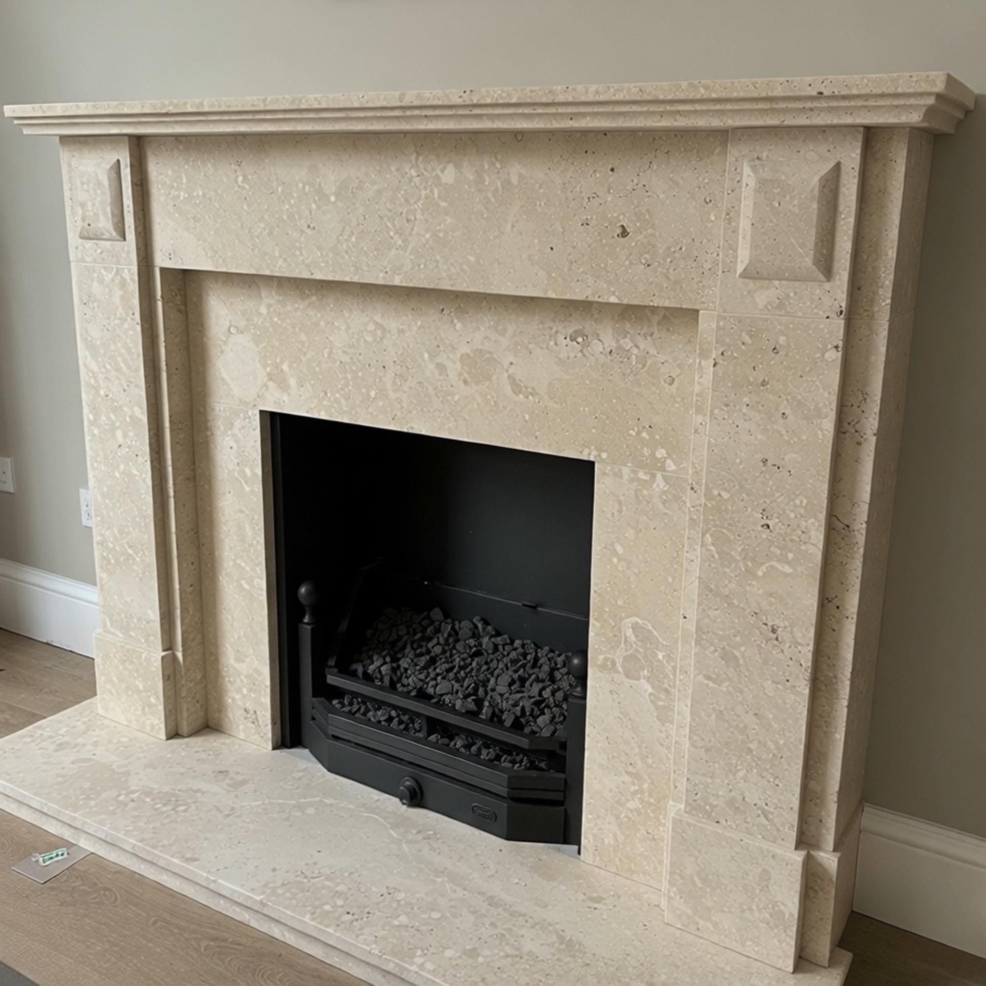 Modern mantelpiece crafted from beige marble, designed with clean lines and classical touches
