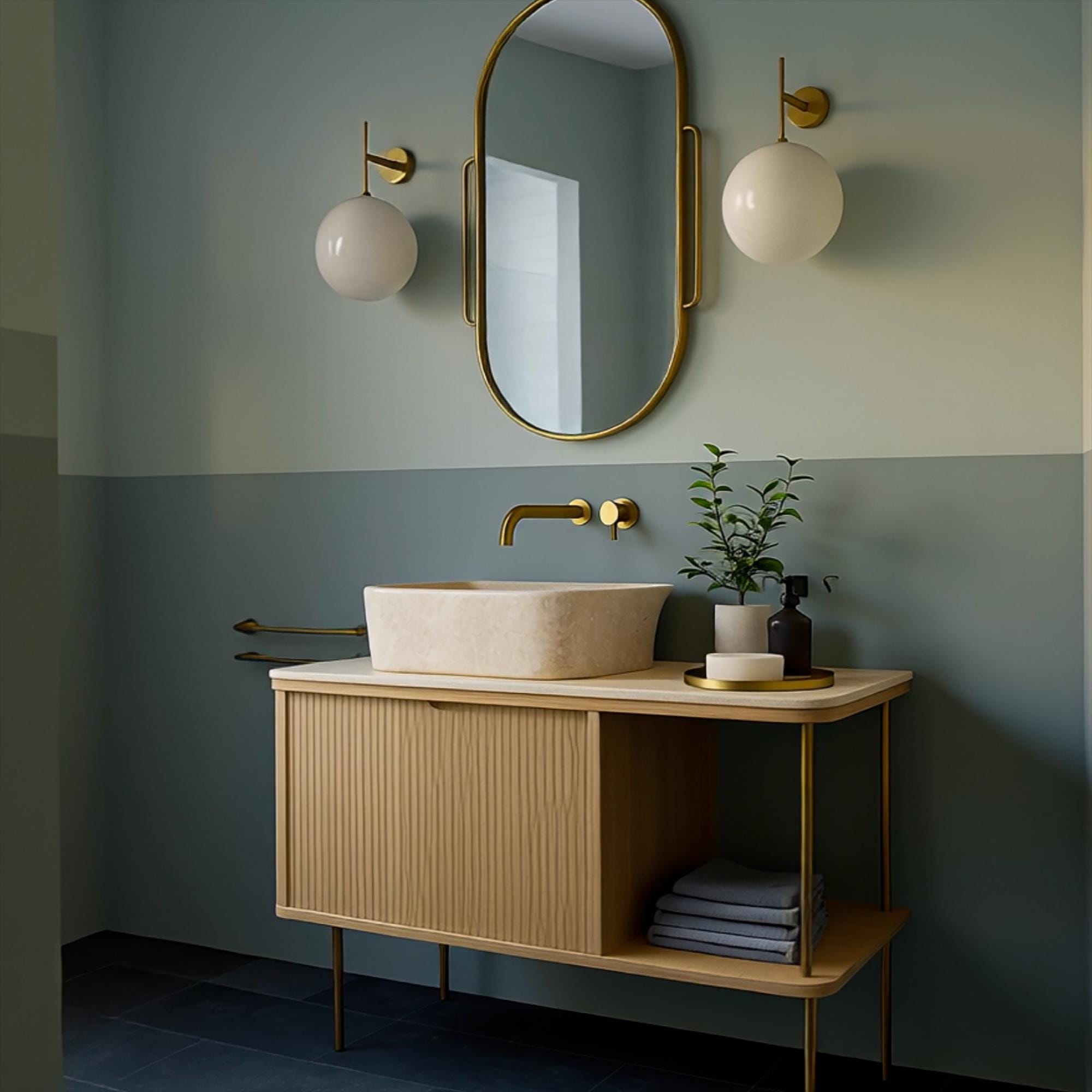 Sleek natural stone basin on minimalist wood vanity with open shelf and brass legs
