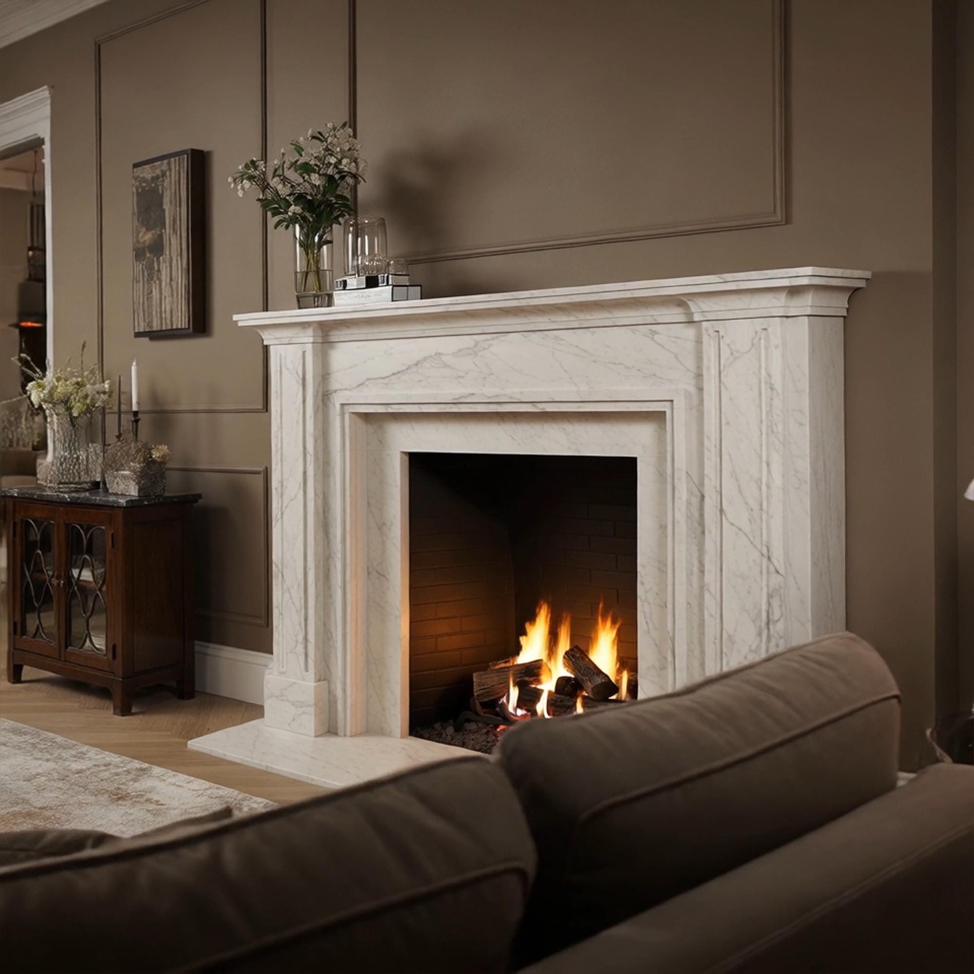 Traditional style mantelpiece in Carrara marble with a soft white tone and natural grey veining