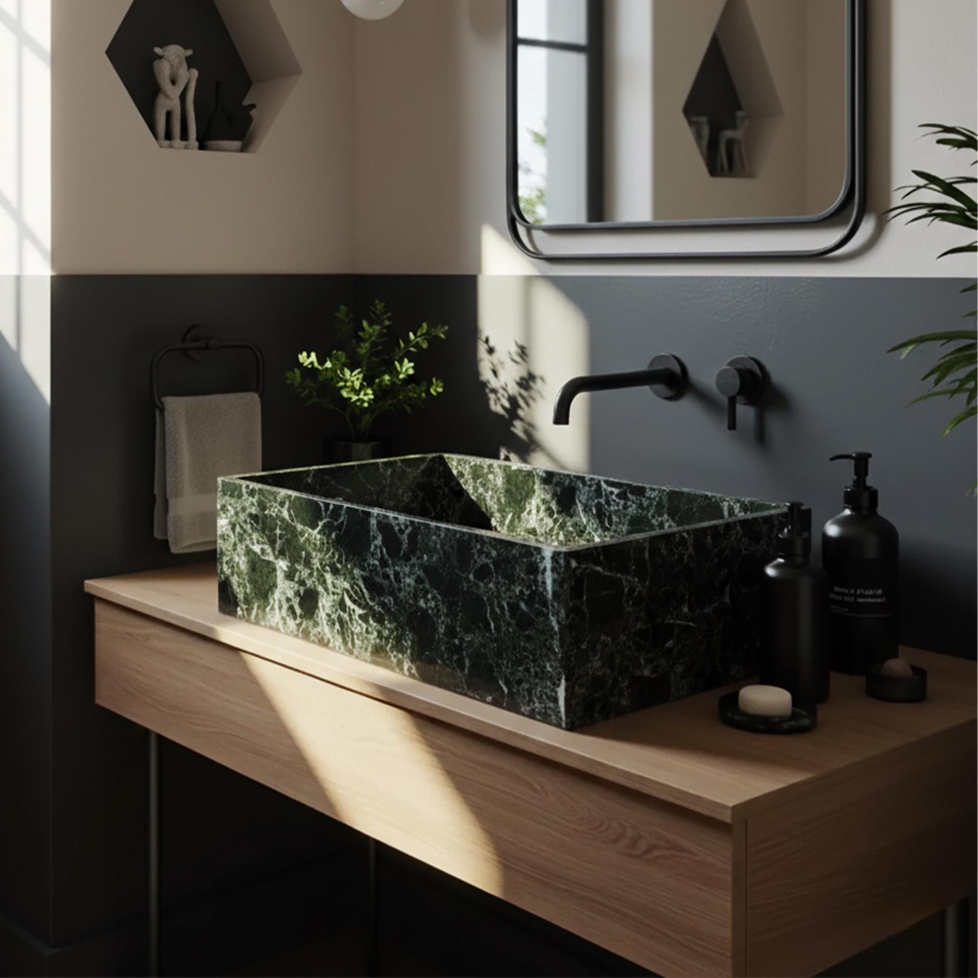 Verde Levanto green marble vessel sink with white veining, placed on minimalist wood vanity with matte black wall-mounted faucet
