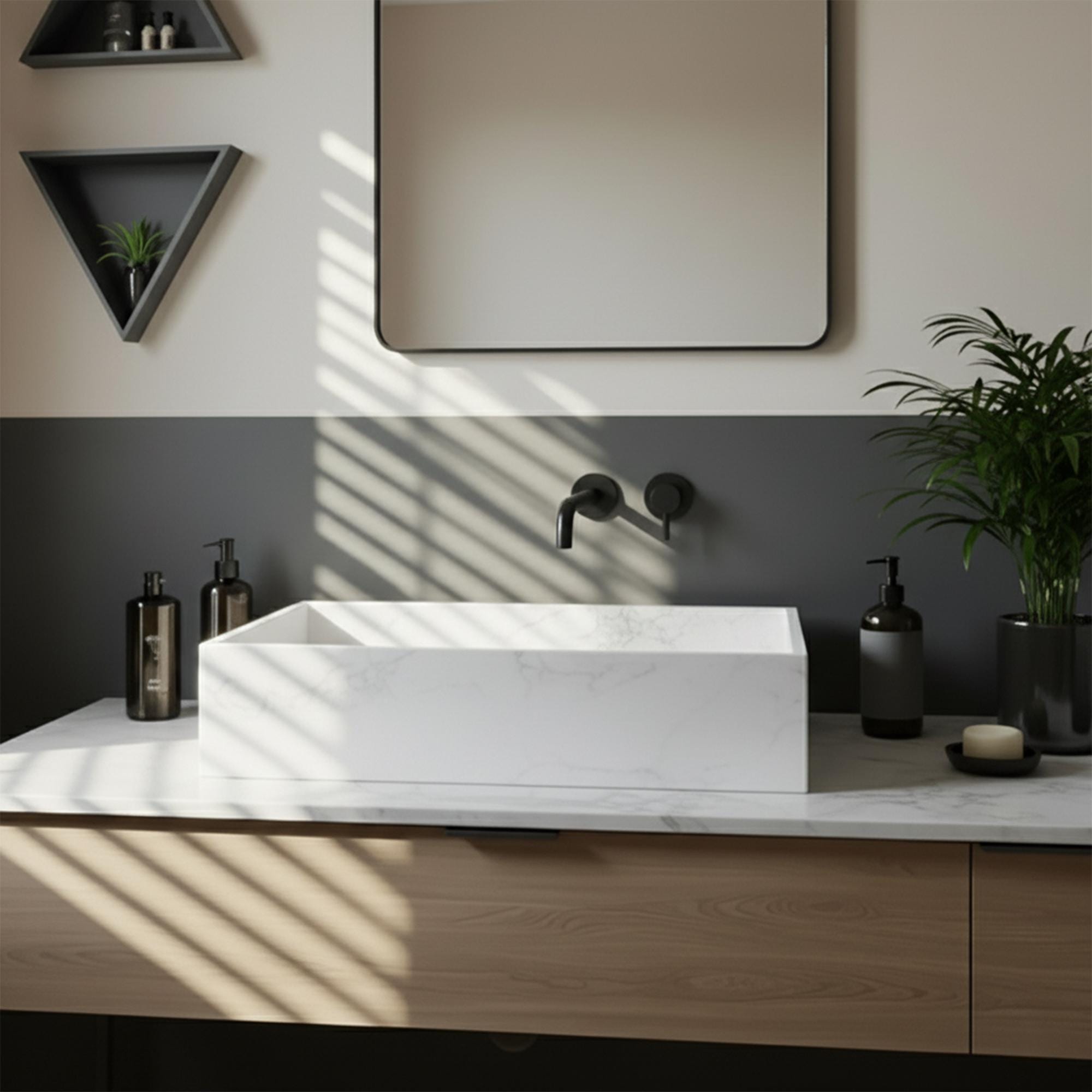 Hand-carved white Carrara marble sink in minimalist design, paired with a light oak floating vanity and soft natural lighting