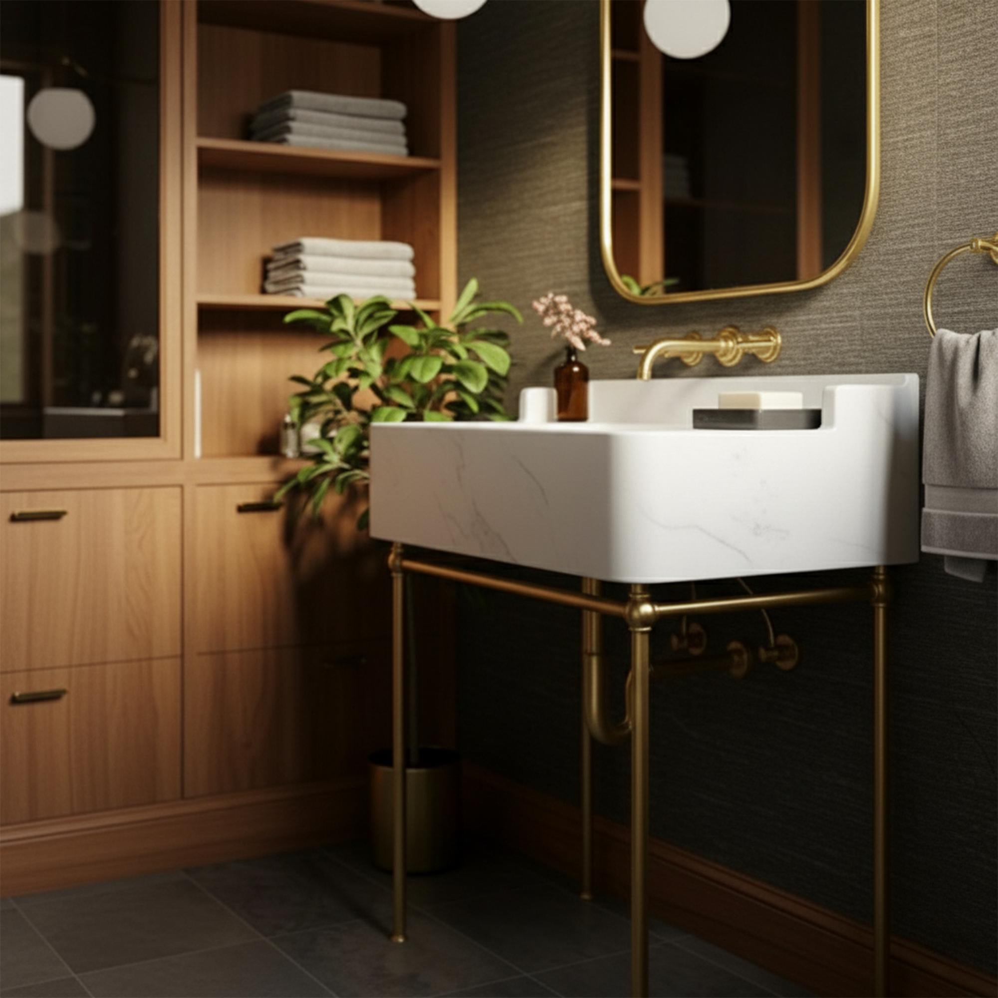 Elegant white marble sink on handcrafted brass frame with modern wall tap and accessories